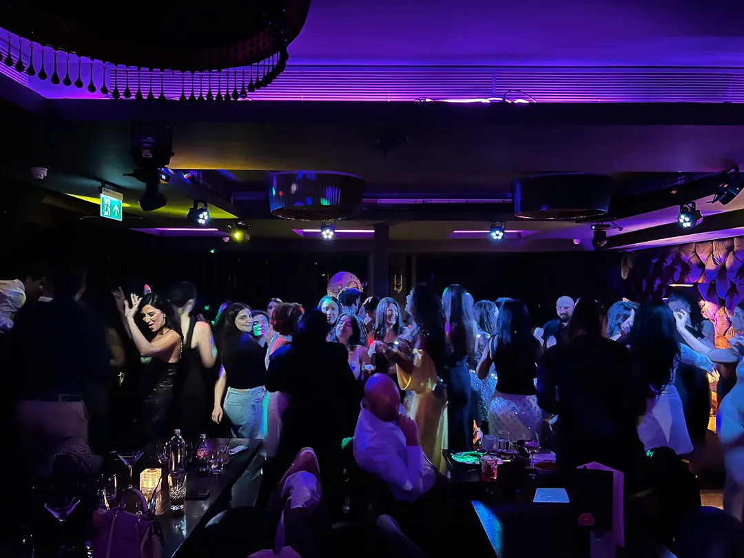 Late night crowd under stage lights